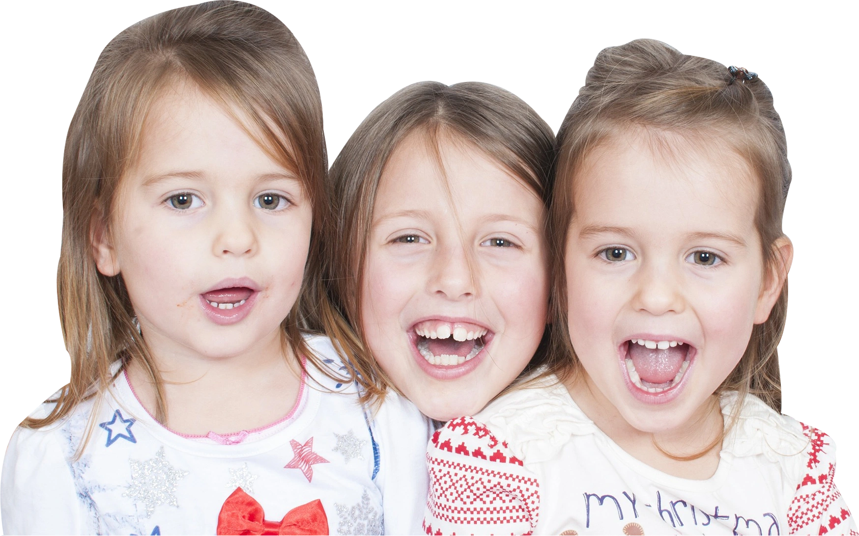 Three young girls are smiling for the camera.